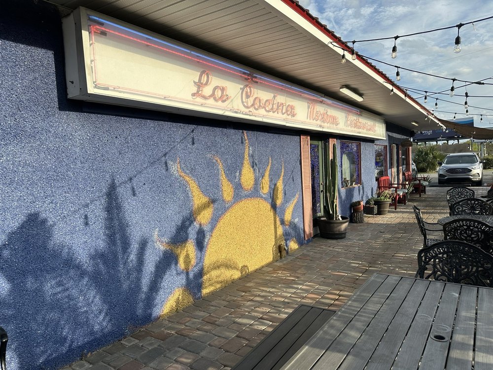 La Cocina storefront with sun mural