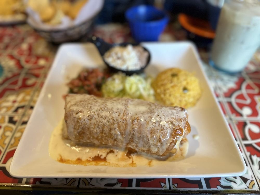 Chicken burrito smothered in sauce